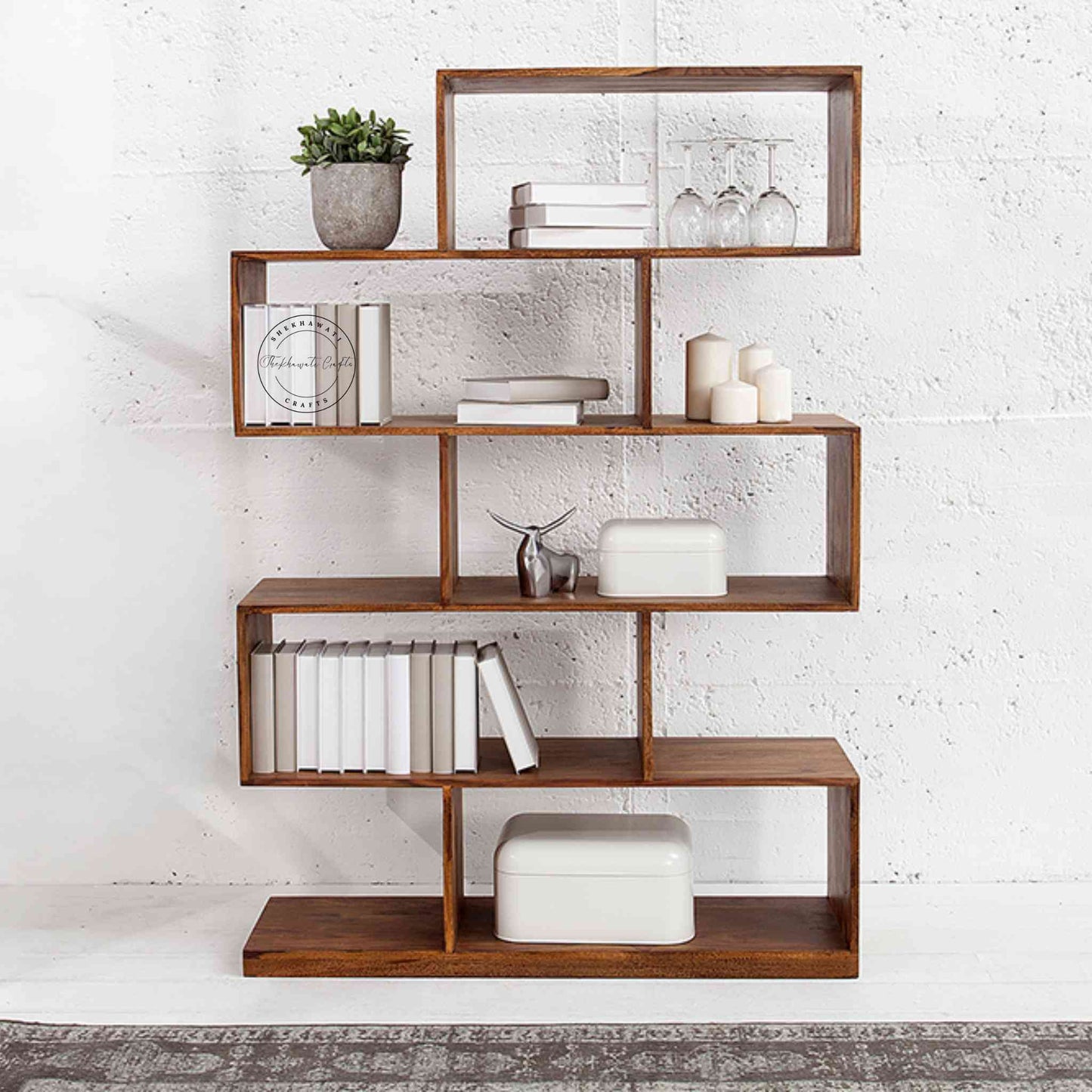 Crony Zig Zag Bookshelve is handcrafted from Sheesham wood, a modern zig zag design with 5 shelves.