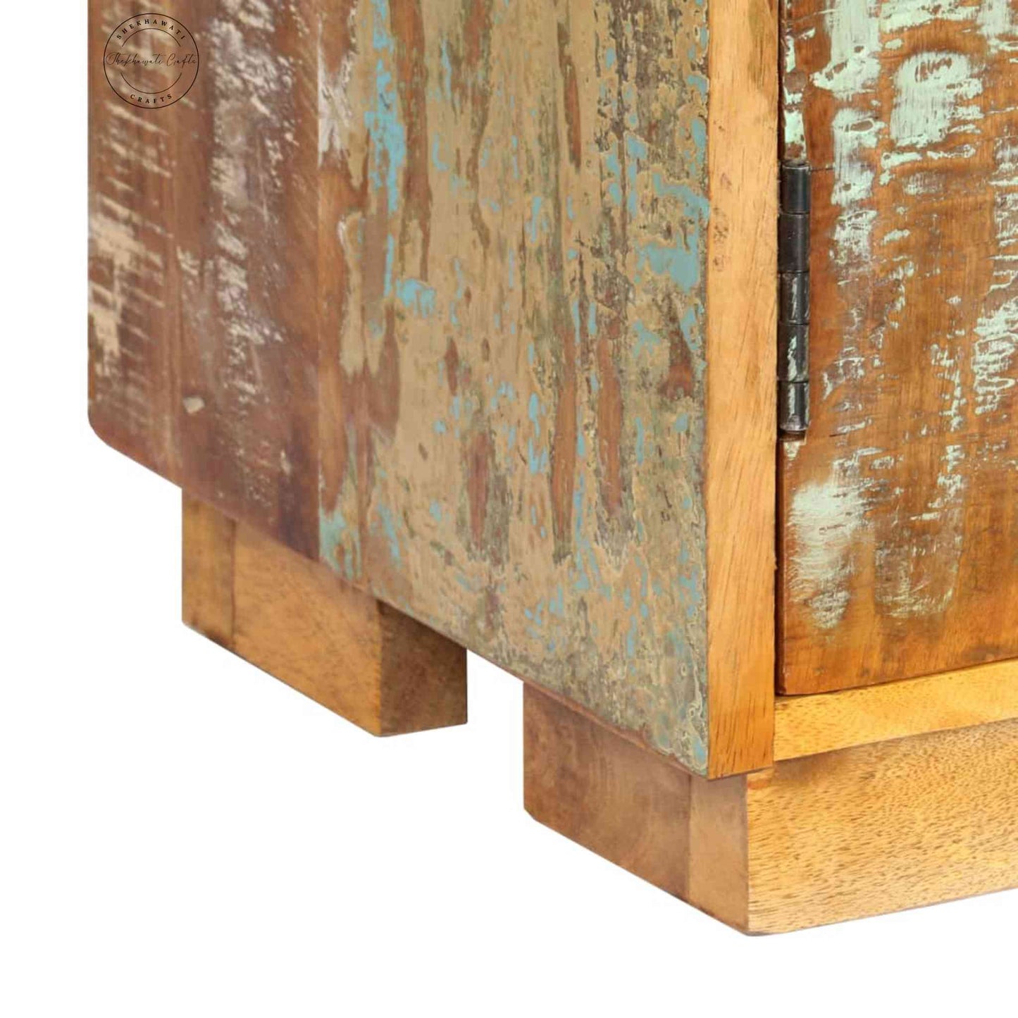 Johan Book Shelf is handcrafted from mango wood, a rustic natural finish, an antique design and 2 doors.