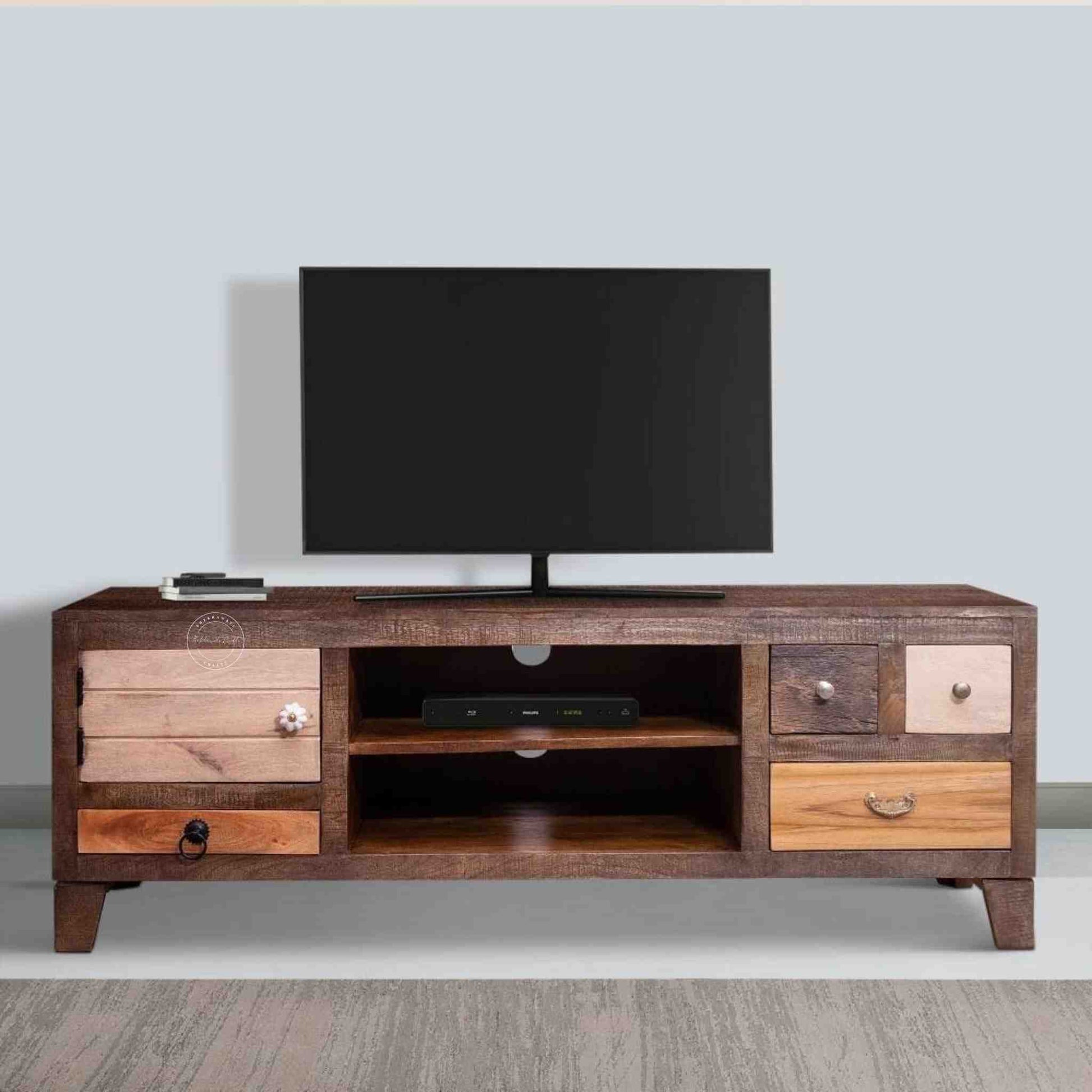 Oslo Mango Wood TV Cabinet with a dual-tone finish, 3 drawers, central open shelf, and wire pass hole.