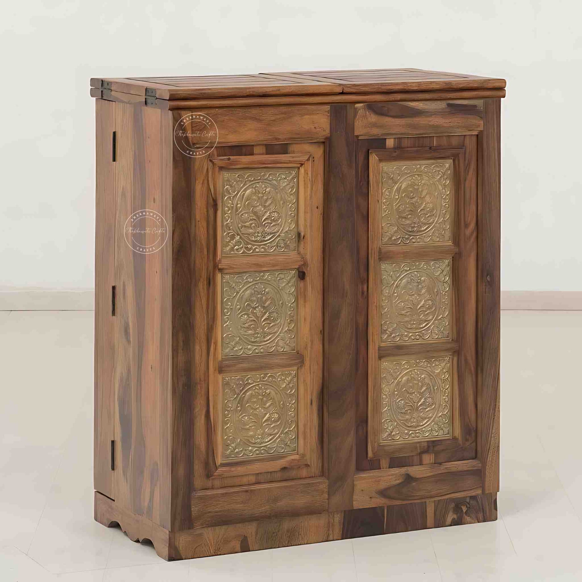 Handmade Sheesham wood bar cabinet with antique brass detailing, natural finish, two doors, spacious drawers, and dedicated storage for bottles and glasses. Ideal for home bar furniture.