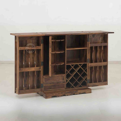 Handmade Sheesham wood bar cabinet with antique brass detailing, natural finish, two doors, spacious drawers, and dedicated storage for bottles and glasses. Ideal for home bar furniture.